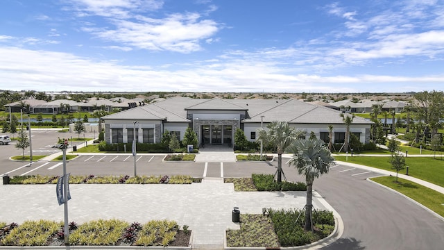 13439 SW River Rock Rd, Port Saint Lucie, FL 34987 - view of property with a residential view and uncovered parking