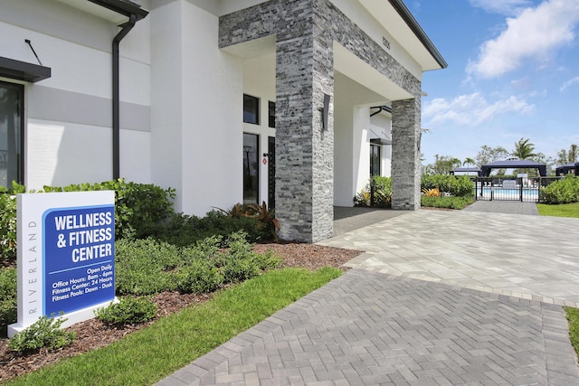 13439 SW River Rock Rd, Port Saint Lucie, FL 34987 - view of home's community with a pool
