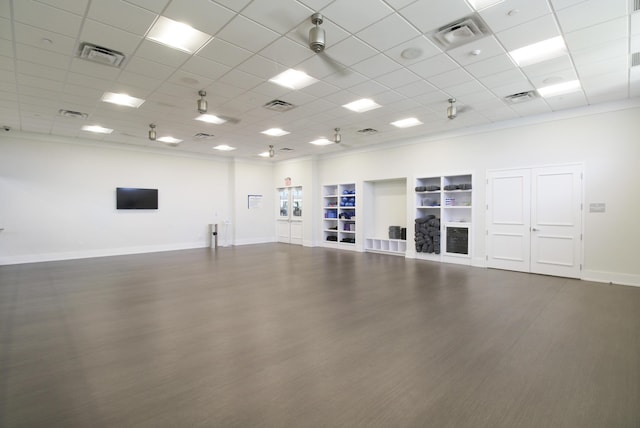 13439 SW River Rock Rd, Port Saint Lucie, FL 34987 - unfurnished room featuring a paneled ceiling, built in features, baseboards, and wood finished floors