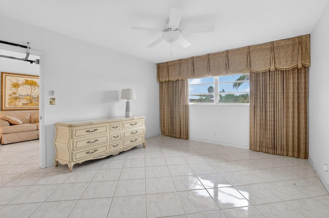 300 NE 20th St Unit 8060, Boca Raton, FL 33431 - bedroom with ceiling fan, a barn door, and light tile patterned floors