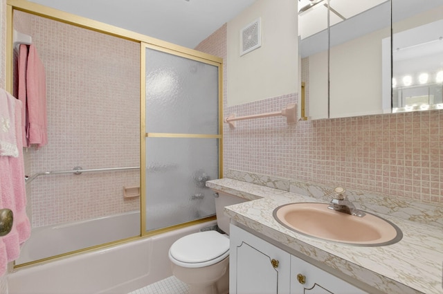 300 NE 20th St Unit 8060, Boca Raton, FL 33431 - bathroom with vanity, toilet, enclosed tub / shower combo, tasteful backsplash, and tile walls