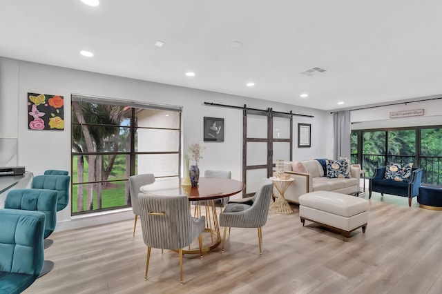 21695 Tall Palm Cir Unit 4B, Boca Raton, FL 33433 - dining area with a barn door, light wood-style floors, and recessed lighting