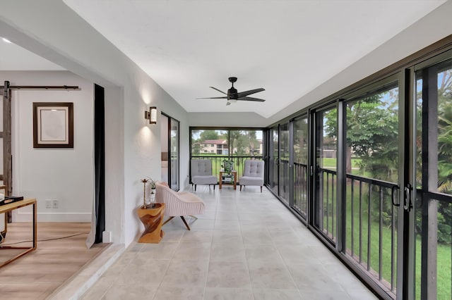 21695 Tall Palm Cir Unit 4B, Boca Raton, FL 33433 - sunroom / solarium with ceiling fan, healthy amount of natural light, and a barn door