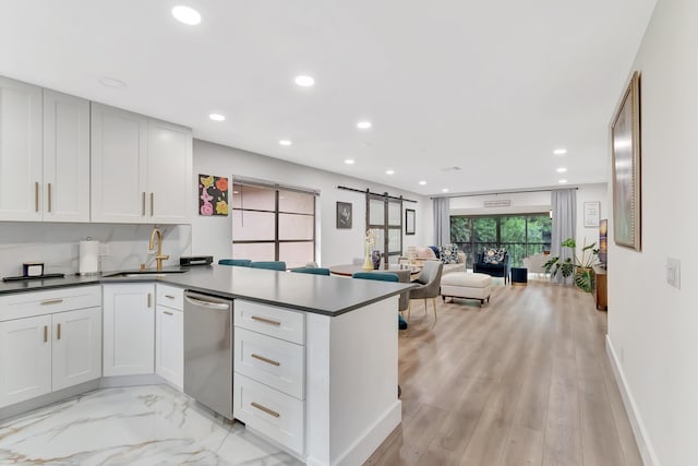 21695 Tall Palm Cir Unit 4B, Boca Raton, FL 33433 - kitchen with dishwasher, a sink, a peninsula, recessed lighting, and open floor plan
