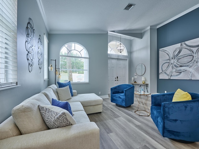 8194 Via Bolzano, Lake Worth, FL 33467 - living area with ornamental molding, wood finished floors, a textured ceiling, and baseboards