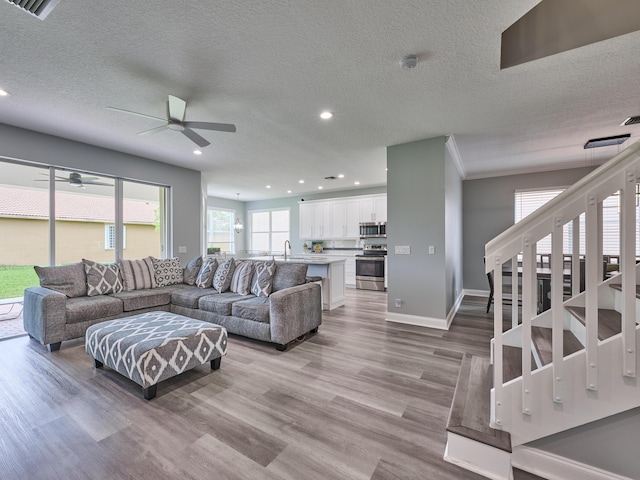 8194 Via Bolzano, Lake Worth, FL 33467 - living area with ceiling fan, recessed lighting, wood finished floors, a textured ceiling, and baseboards
