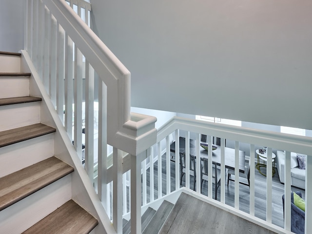 8194 Via Bolzano, Lake Worth, FL 33467 - stairs with plenty of natural light and wood finished floors