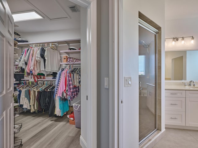 8194 Via Bolzano, Lake Worth, FL 33467 - spacious closet with a sink and light wood finished floors