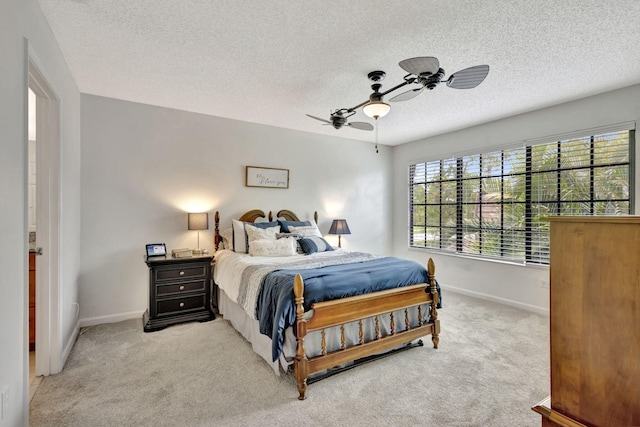 146 Weybridge Cir Unit B, Royal Palm Beach, FL 33411 - bedroom with baseboards, light carpet, a textured ceiling, and ceiling fan