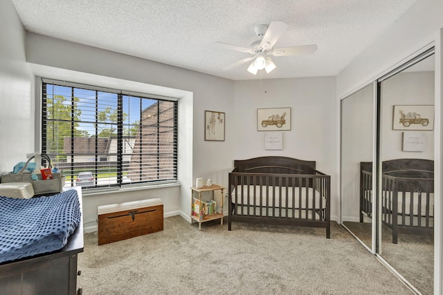 146 Weybridge Cir Unit B, Royal Palm Beach, FL 33411 - carpeted bedroom featuring a closet, a textured ceiling, a ceiling fan, and baseboards