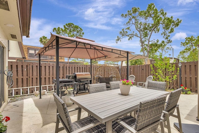 146 Weybridge Cir Unit B, Royal Palm Beach, FL 33411 - fenced backyard featuring a gazebo, a patio, outdoor dining space, and area for grilling