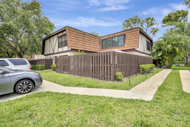 146 Weybridge Cir Unit B, Royal Palm Beach, FL 33411 - view of property exterior featuring mansard roof