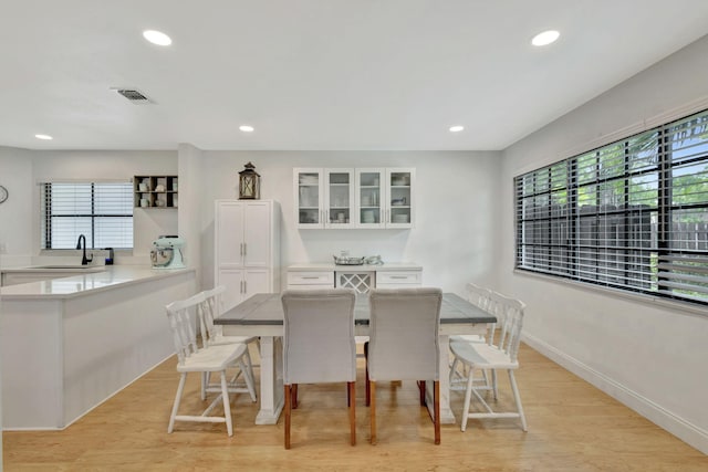 146 Weybridge Cir Unit B, Royal Palm Beach, FL 33411 - dining area featuring recessed lighting, light wood-style flooring, and baseboards
