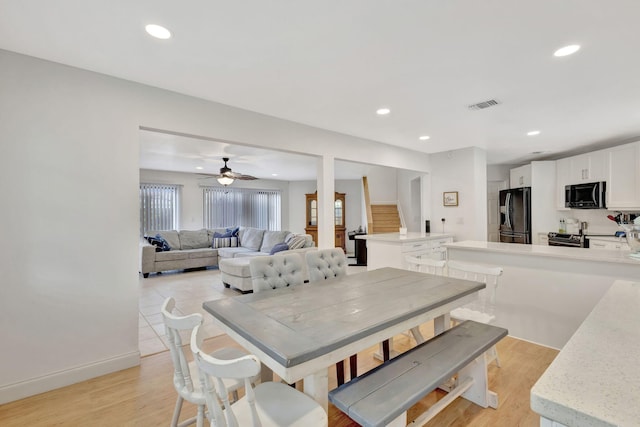 146 Weybridge Cir Unit B, Royal Palm Beach, FL 33411 - dining room with recessed lighting, a ceiling fan, light wood finished floors, and baseboards