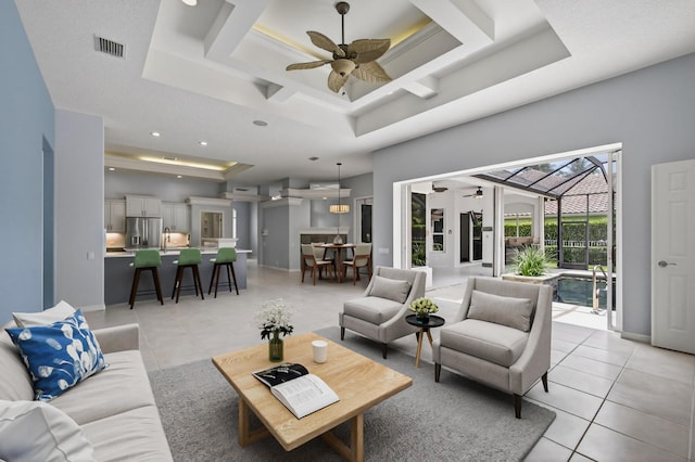 19050 SE Kokomo Ln, Jupiter, FL 33458 - living area with a raised ceiling, light tile patterned floors, a ceiling fan, recessed lighting, and coffered ceiling