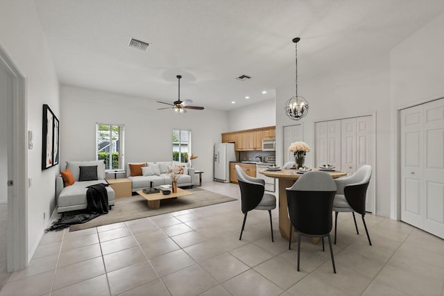 19050 SE Kokomo Ln, Jupiter, FL 33458 - dining space featuring a ceiling fan, a chandelier, light tile patterned floors, and recessed lighting