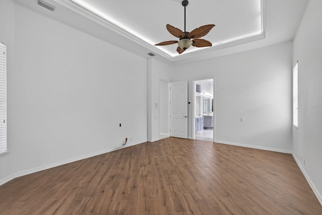 19050 SE Kokomo Ln, Jupiter, FL 33458 - unfurnished room featuring ceiling fan, a tray ceiling, and wood finished floors