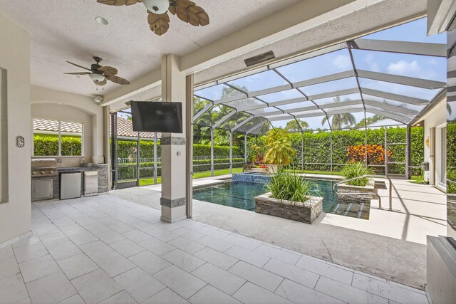19050 SE Kokomo Ln, Jupiter, FL 33458 - view of patio with area for grilling, a ceiling fan, and a lanai