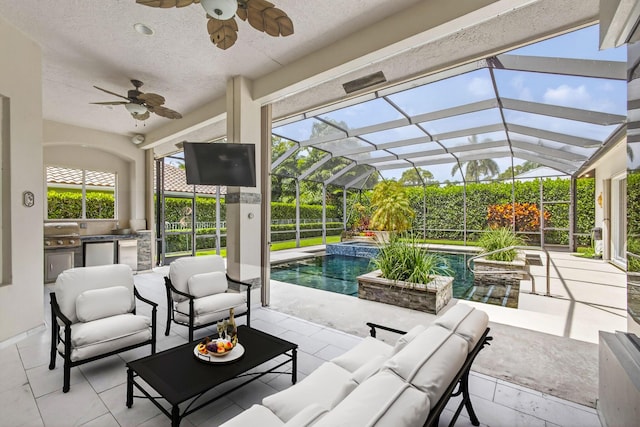 19050 SE Kokomo Ln, Jupiter, FL 33458 - view of patio featuring area for grilling, a ceiling fan, an outdoor living space, and a lanai