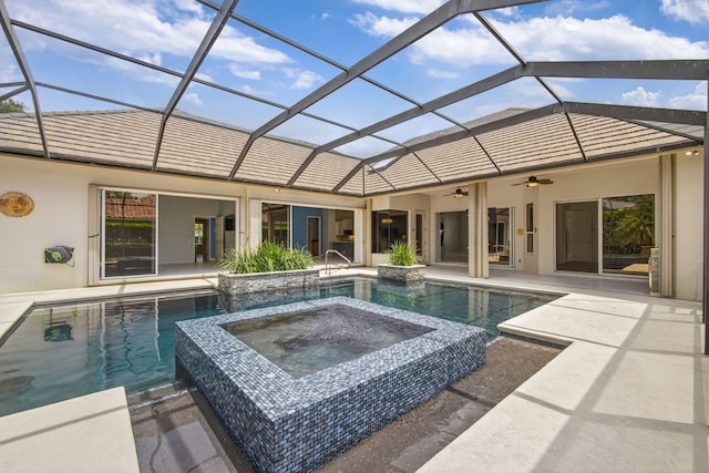 19050 SE Kokomo Ln, Jupiter, FL 33458 - view of pool with a patio, ceiling fan, a pool with connected hot tub, and glass enclosure