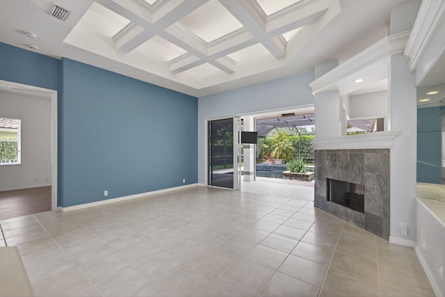 19050 SE Kokomo Ln, Jupiter, FL 33458 - unfurnished living room featuring coffered ceiling, a fireplace, light tile patterned floors, beamed ceiling, and a high ceiling