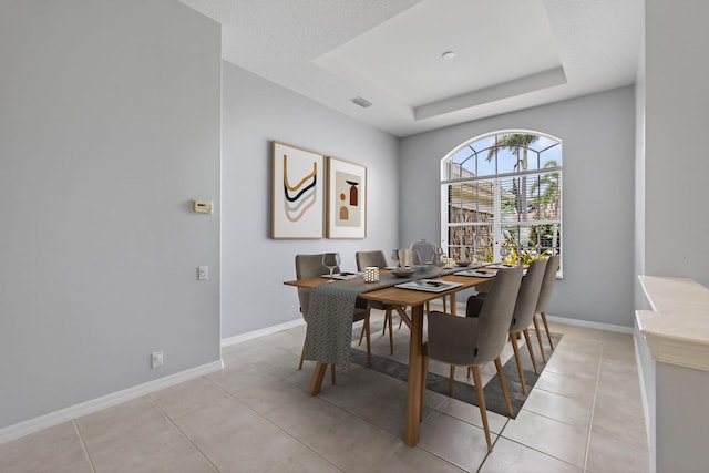 19050 SE Kokomo Ln, Jupiter, FL 33458 - dining area featuring a raised ceiling and light tile patterned floors