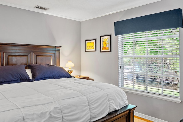 9494 SE Cove Point St, Jupiter, FL 33469 - bedroom with ornamental molding and multiple windows