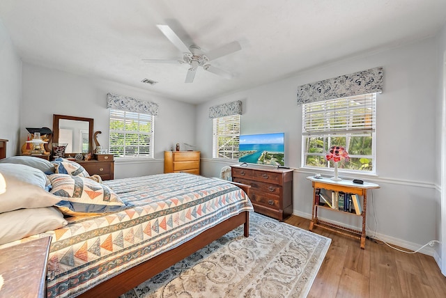 9494 SE Cove Point St, Jupiter, FL 33469 - bedroom with hardwood / wood-style floors and ceiling fan