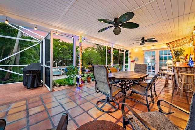 9494 SE Cove Point St, Jupiter, FL 33469 - view of patio with outdoor dining area, a lanai, ceiling fan, and area for grilling
