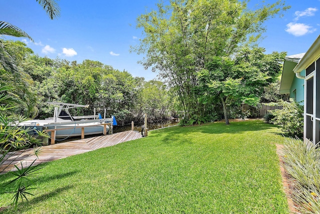 9494 SE Cove Point St, Jupiter, FL 33469 - view of yard with a dock