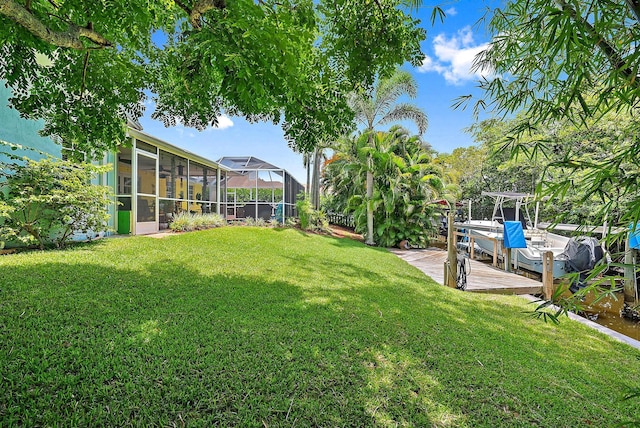9494 SE Cove Point St, Jupiter, FL 33469 - view of grassy yard featuring a dock