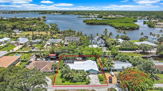 9494 SE Cove Point St, Jupiter, FL 33469 - aerial view of residential area with property boundaries highlighted and a large body of water