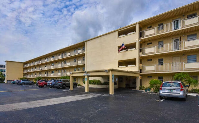 2615 NE 3rd Ct Unit 217, Boynton Beach, FL 33435 - view of apartment building / complex featuring uncovered parking