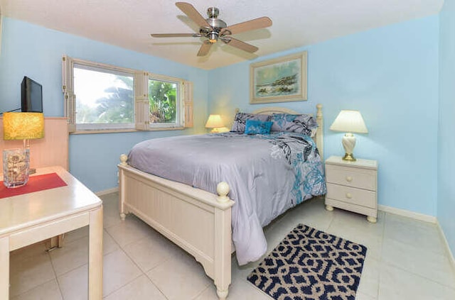 2615 NE 3rd Ct Unit 217, Boynton Beach, FL 33435 - bedroom featuring light tile patterned flooring, baseboards, and ceiling fan