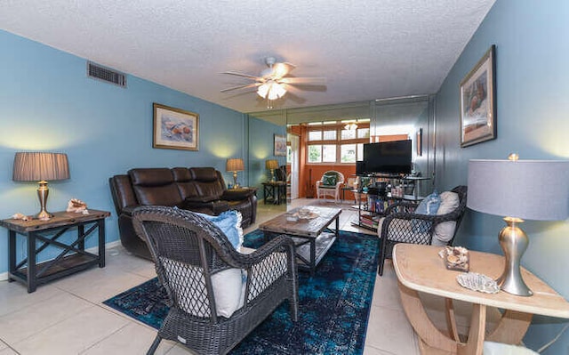 2615 NE 3rd Ct Unit 217, Boynton Beach, FL 33435 - living room with a textured ceiling, ceiling fan, and tile patterned flooring