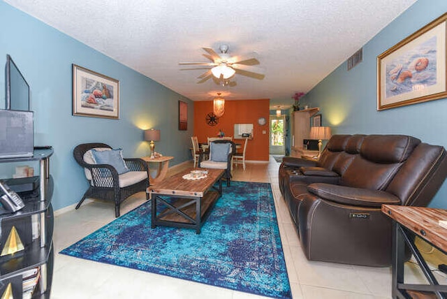 2615 NE 3rd Ct Unit 217, Boynton Beach, FL 33435 - living area with a ceiling fan and a textured ceiling
