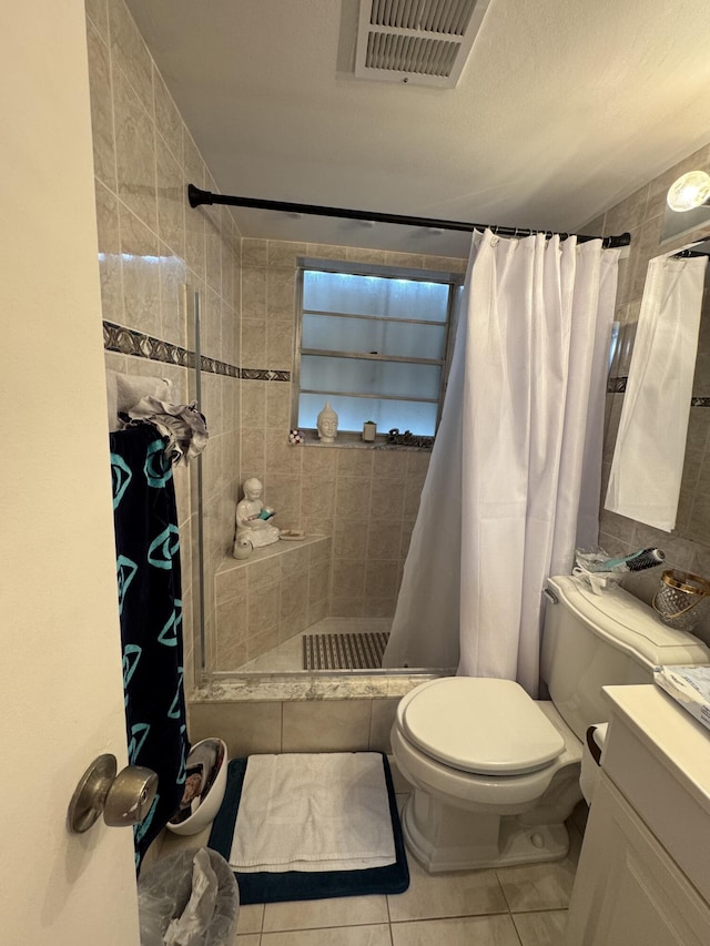 203 S Windsor I Unit 203, West Palm Beach, FL 33417 - full bath featuring toilet, tiled shower, vanity, and tile patterned flooring