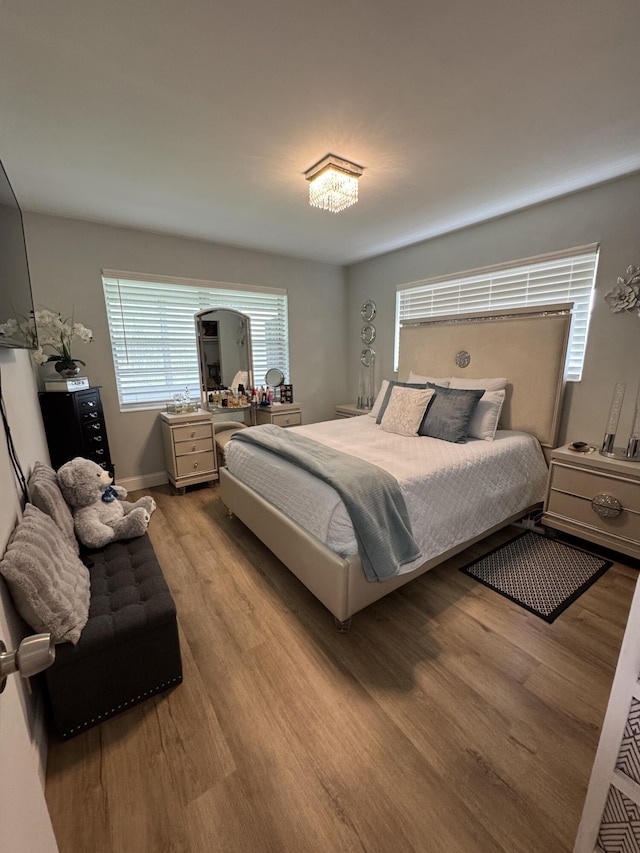 203 S Windsor I Unit 203, West Palm Beach, FL 33417 - bedroom with wood finished floors and baseboards