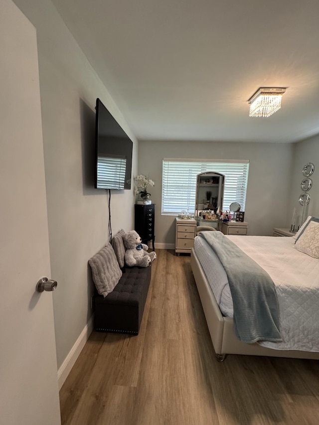 203 S Windsor I Unit 203, West Palm Beach, FL 33417 - bedroom featuring wood finished floors and baseboards