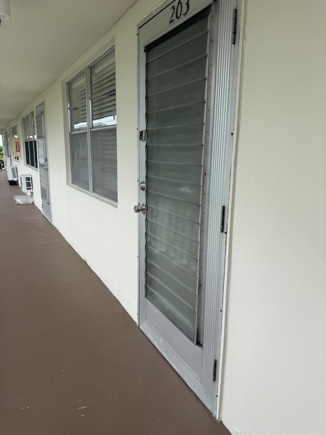 203 S Windsor I Unit 203, West Palm Beach, FL 33417 - property entrance featuring stucco siding