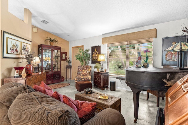 16243 E Calder Dr, Loxahatchee, FL 33470 - living room with lofted ceiling and a textured ceiling