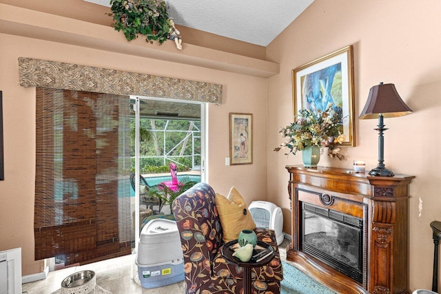 16243 E Calder Dr, Loxahatchee, FL 33470 - living area featuring a glass covered fireplace and baseboards