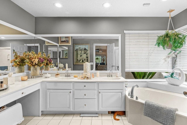 16243 E Calder Dr, Loxahatchee, FL 33470 - full bath with double vanity, a bath, tile patterned flooring, recessed lighting, and a ceiling fan