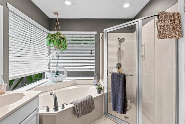 16243 E Calder Dr, Loxahatchee, FL 33470 - bathroom featuring a bath, vanity, a stall shower, a textured ceiling, and recessed lighting