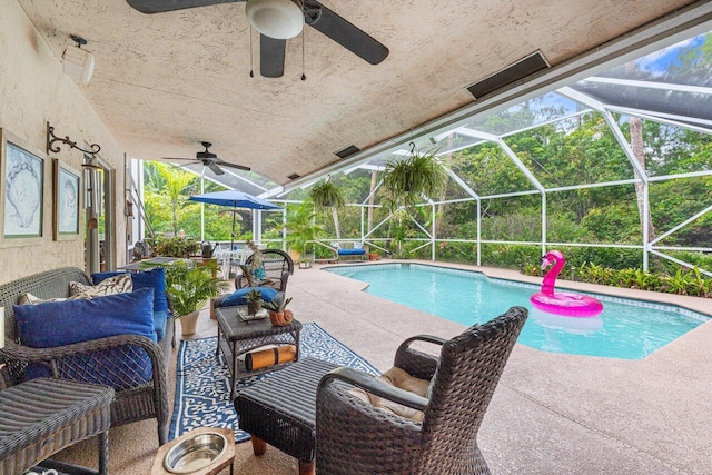16243 E Calder Dr, Loxahatchee, FL 33470 - outdoor pool featuring ceiling fan, a patio area, outdoor lounge area, and glass enclosure
