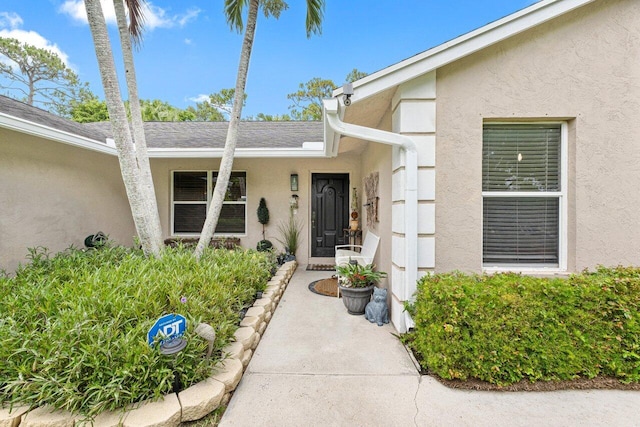 16243 E Calder Dr, Loxahatchee, FL 33470 - doorway to property with stucco siding