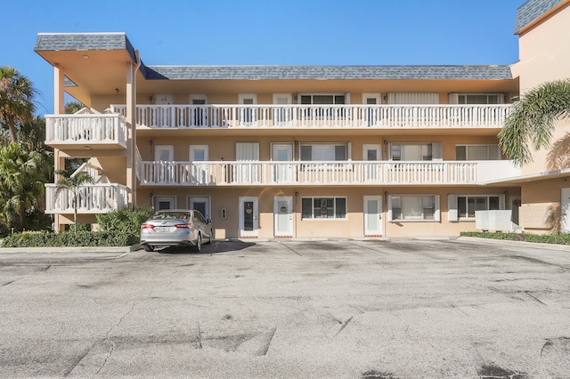 131 Doolen Ct Unit 310, North Palm Beach, FL 33408 - view of apartment building / complex with uncovered parking