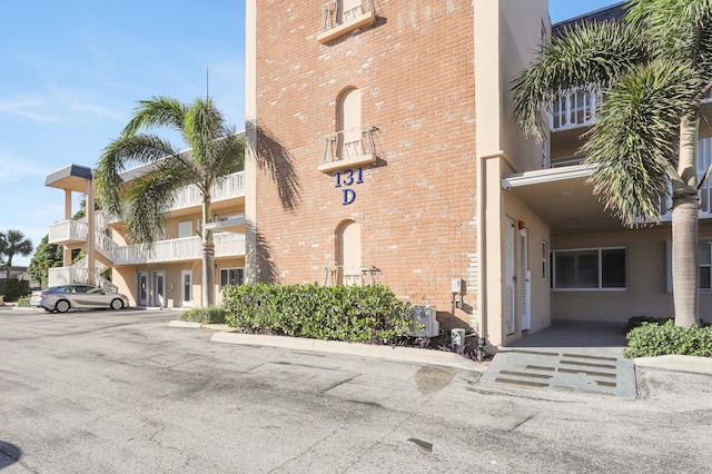 131 Doolen Ct Unit 310, North Palm Beach, FL 33408 - view of property with uncovered parking