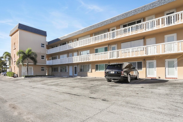 131 Doolen Ct Unit 310, North Palm Beach, FL 33408 - view of apartment building / complex featuring uncovered parking