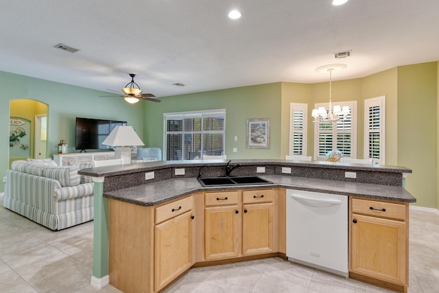 169 Stony Point Dr, Sebastian, FL 32958 - kitchen featuring white dishwasher, a sink, open floor plan, a chandelier, and light tile patterned flooring